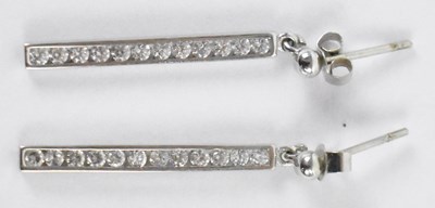 Lot 850 - A pair of 9ct white gold diamond set drop...