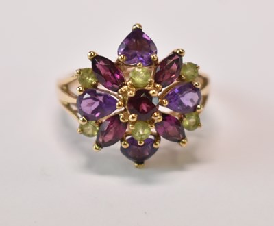 Lot 632 - A 9ct yellow gold floral set dress ring, size...