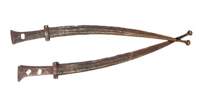 Lot 542 - A pair of Tuareg swords in elaborate leather...