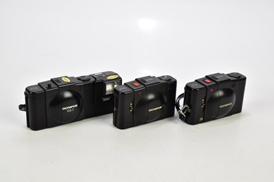 Lot 530 - OLYMPUS; three Olympus compact cameras,...