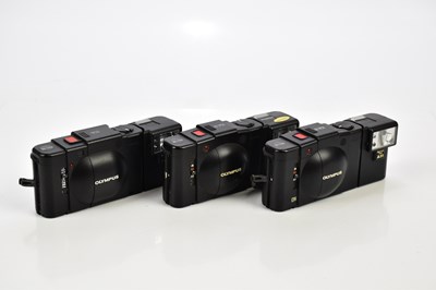 Lot 463 - OLYMPUS; three Olympus compact cameras,...