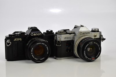 Lot 454 - CANON; two Canon 35mm film cameras, comprising...