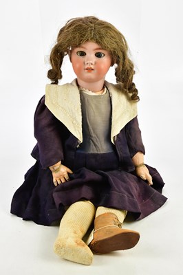 Lot 67 - DEP; a French bisque headed doll with painted...