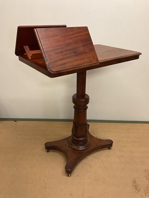 Lot 774 - A mahogany telescopic reading table fitted on...