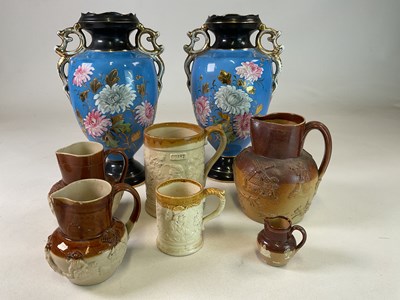 Lot 286 - WINTERTON; a pair of floral decorated vases...