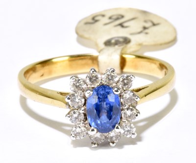 Lot 1103 - An 18ct yellow gold sapphire and diamond...