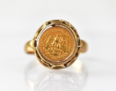 Lot 863 - A 9ct gold ring set with a 'Dos Pesos' gold...