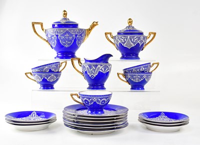 Lot 363 - A dark blue ground tea service decorated with...