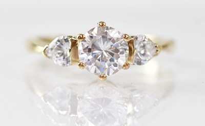 Lot 875 - A 9ct yellow gold ring set with a central...