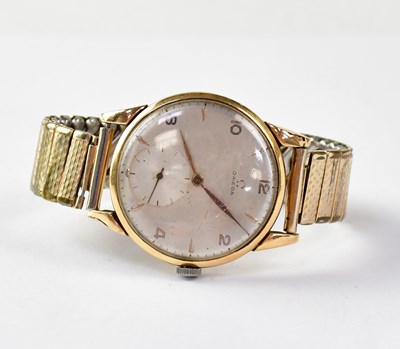 Lot 959 - OMEGA; an 18ct gold watch, the silvered dial...