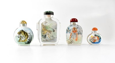 Lot 220 - Four Chinese glass scent/snuff bottles painted...