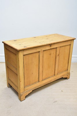 Lot 1253 - An old pine panelled blanket box with hinged...