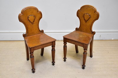 Lot 1206 - A pair of Victorian oak hall chairs on turned...