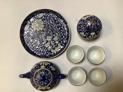 Lot 203 - A small modern Chinese seven-piece blue ground...