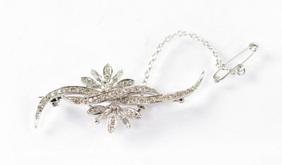 Lot 794 - A white metal and diamond floral brooch with...