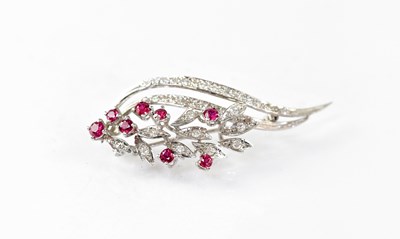 Lot 795 - An 18ct white gold floral spray brooch set...