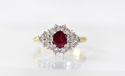 Lot 895 - An 18ct gold ring with claw set marquise ruby...