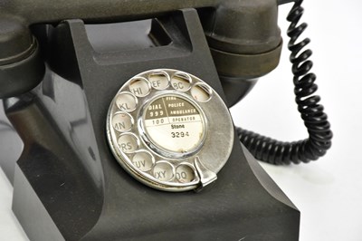 Lot 1615 - A black bakelite rotary telephone.