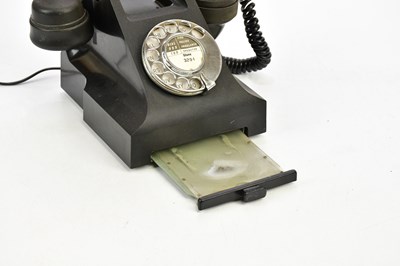 Lot 1615 - A black bakelite rotary telephone.