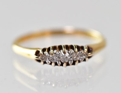 Lot 899 - An 18ct gold ring set with five graduated...