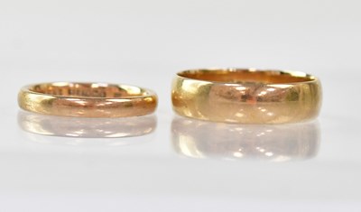 Lot 853 - Two 9ct gold wedding bands, the wide example...