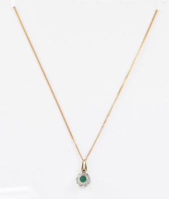 Lot 802 - A 9ct gold pendant with bezel set round...