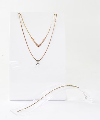 Lot 805 - Two 9ct gold flat rigid link necklaces, one...