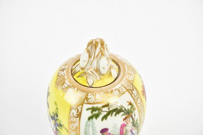 Lot 2438 - BERLIN; an egg shaped lidded vase, painted...