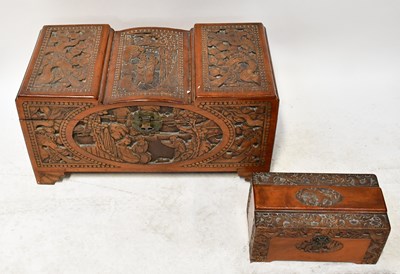 Lot 304 - A Chinese carved camphor wood chest with metal...