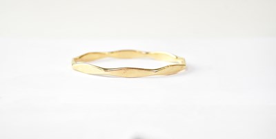 Lot 776 - A 9ct gold angular bangle, diameter 6.5cm,...