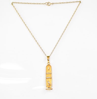 Lot 816 - A yellow metal Egyptian themed pendant on 9ct...