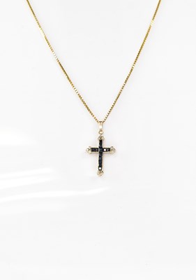 Lot 821 - A 9ct gold cross pendant set with diamond...