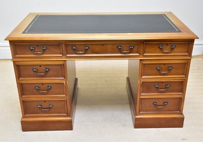 Lot 1102 - A reproduction twin pedestal kneehole desk,...