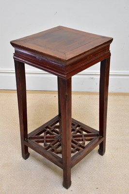 Lot 1104 - A modern Chinese jardinière stand with carved...