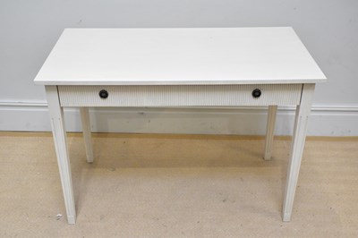 Lot 1097 - A modern cream painted side table with single...