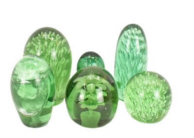 Lot 407 - Six 19th century green glass dump paperweights,...