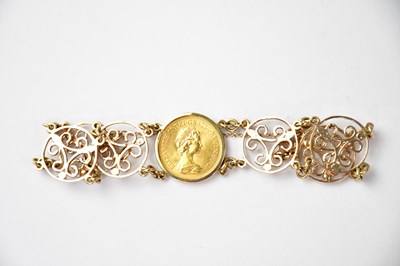 Lot 779 - A 9ct gold bracelet with central mounted...