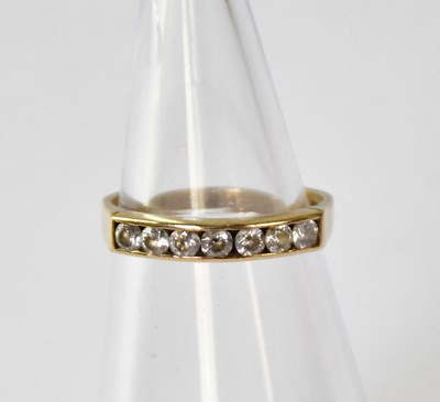 Lot 868 - A 9ct gold half eternity ring, channel set...