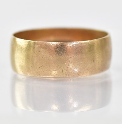 Lot 852 - A 9ct gold wide wedding band, size V, approx....