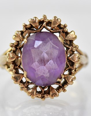 Lot 873 - A 9ct gold dress ring with claw set amethyst...