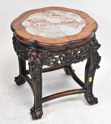 Lot 13 - A 20th century Oriental hardwood carved table...
