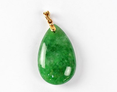 Lot 801 - A green jade pendant with 9ct gold mount,...