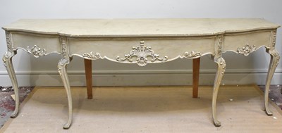 Lot 1050 - A reproduction painted carved wood serpentine...