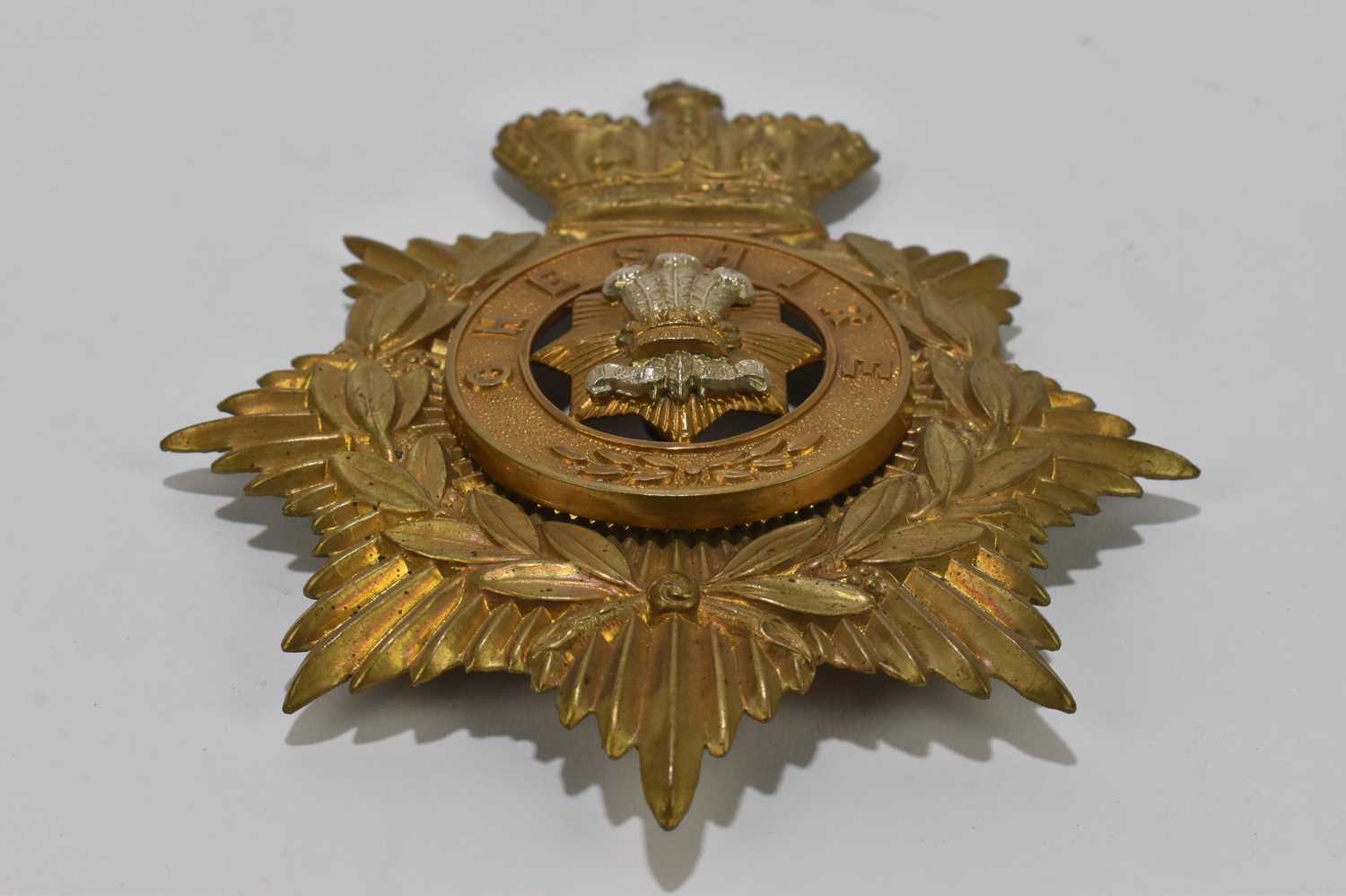 Lot 407 - A Cheshire Regiment gilt metal helmet plate