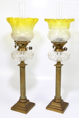 Lot 202 - A near pair of 19th century oil lamps with...