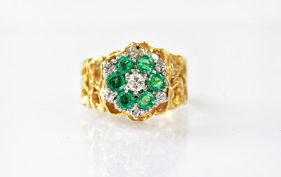 Lot 903 - An 18ct gold ring set with central diamond...