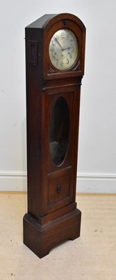 Lot 666 - An early 20th century oak longcase clock of...