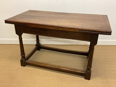 Lot 775 - An oak draw-leaf plank top refectory type...