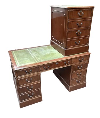 Lot 1088 - A reproduction mahogany kneehole desk with...