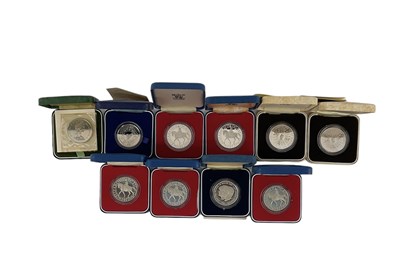 Lot 895 - Eleven cased commemorative silver coins,...